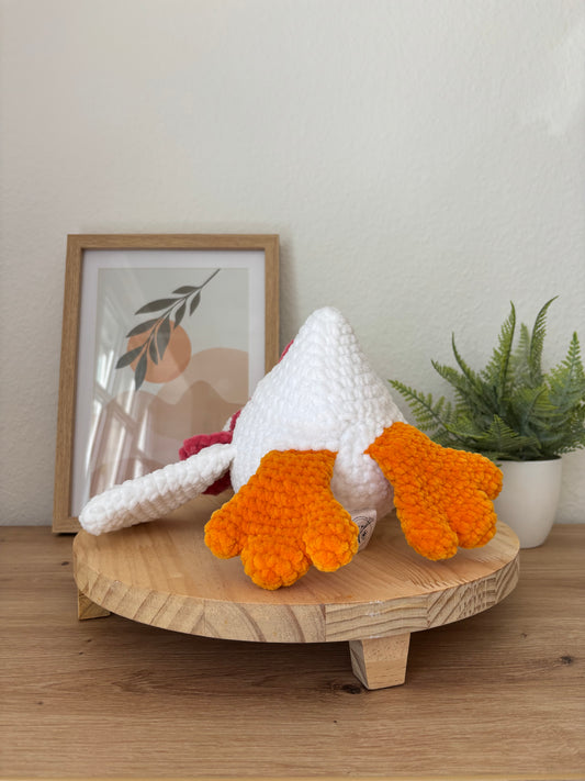 Liegende Gans mit Schleife